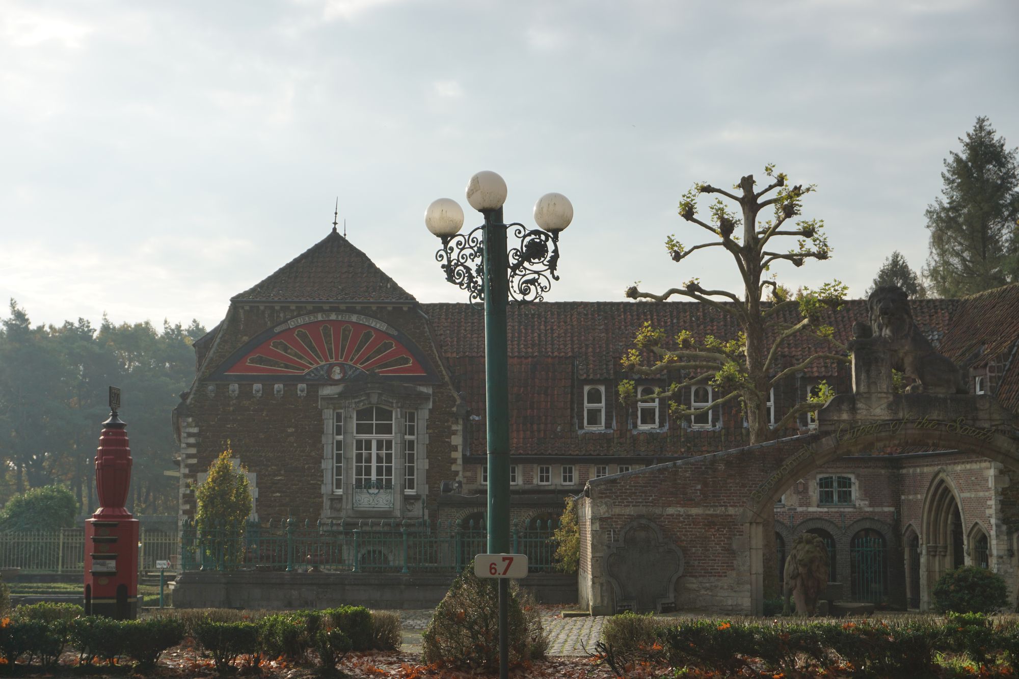 A Gothic-looking building, "Queen of the South" embossed in an arc on a gable.