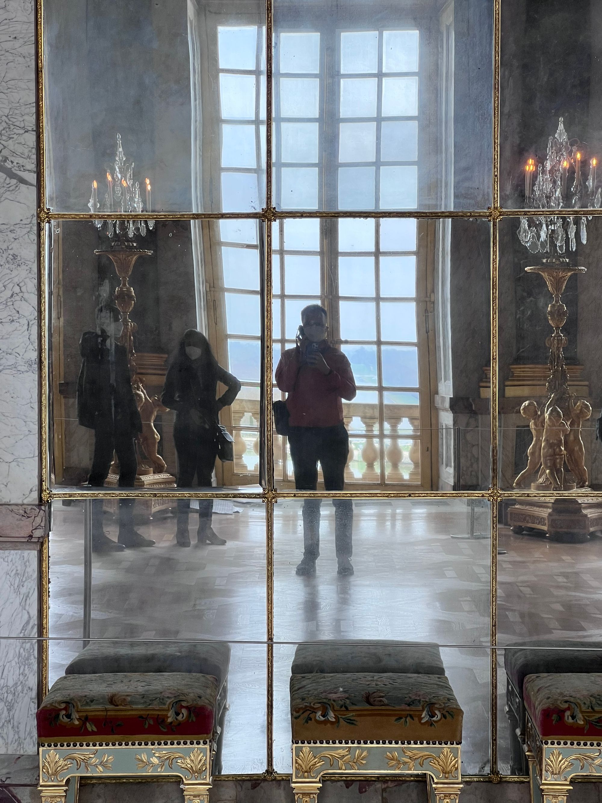 Self portrait of Jonathan in the wall of gilded mirrors in the Versailles hall of mirrors.