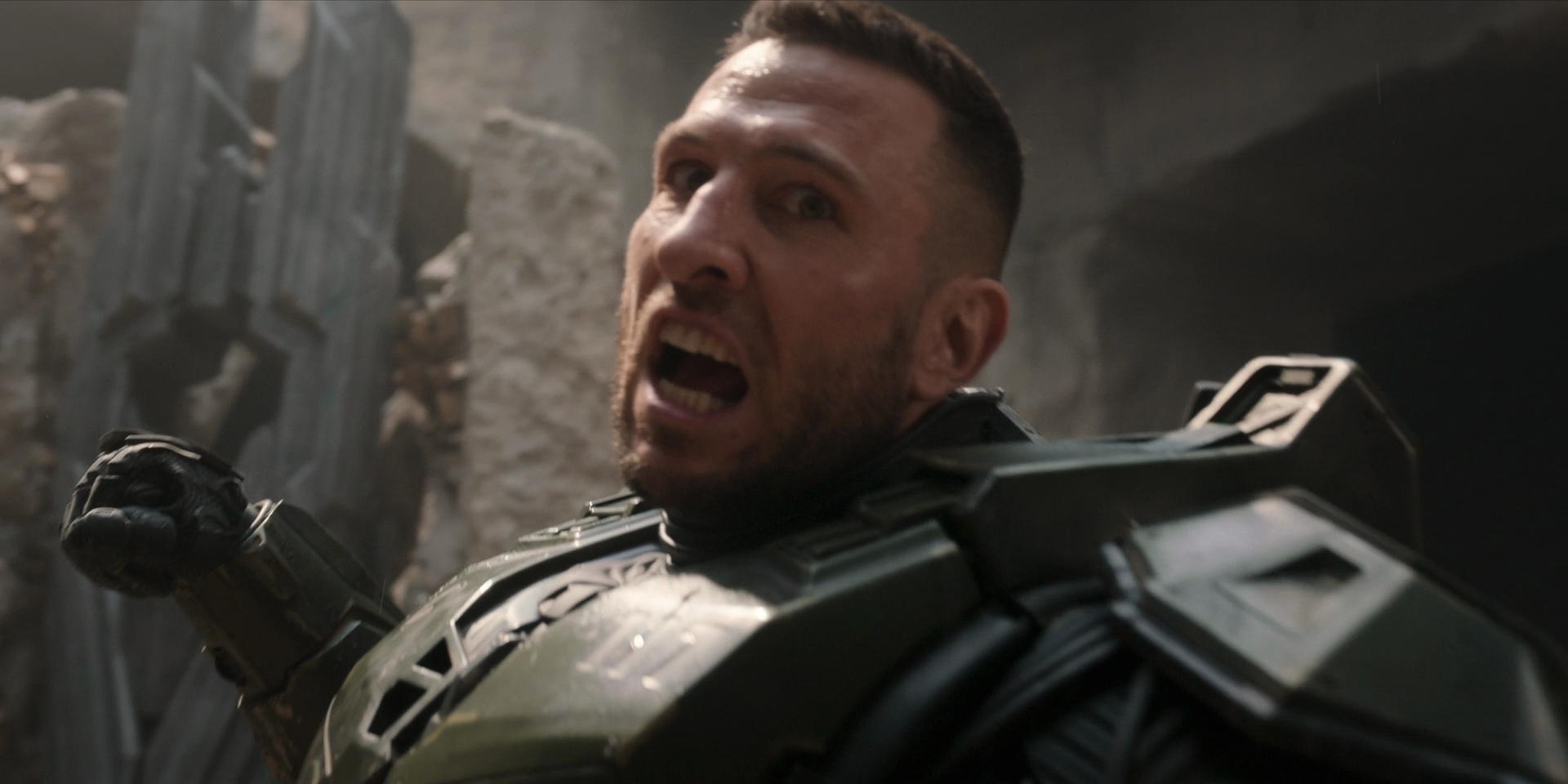 The Master Chief, mid-jump, pulling his fist back for a punch, looking like an anime character mid-powerup