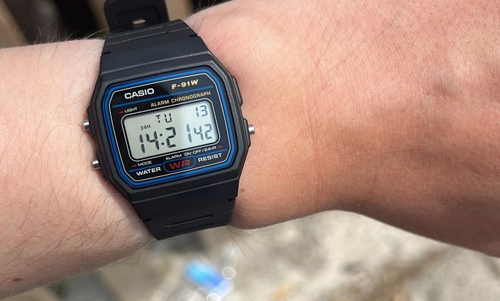 Jonathan’s wrist wearing an Casio watch showing the time as 14:21:42.