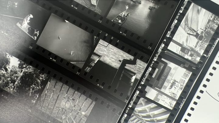 Two black and white contact sheets laid on top of each other.